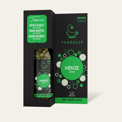 Refreshing Minze TEABALLS drink served with sliced lemons and ice cubes